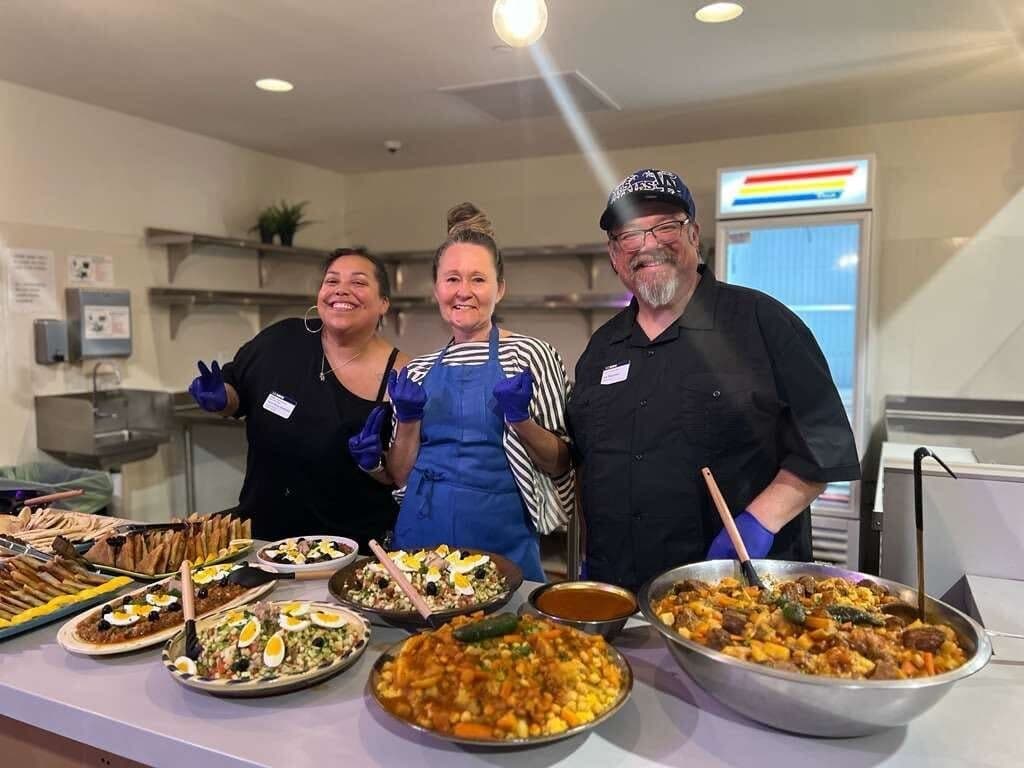 Volunteers serving food at a Transformative Recreation event