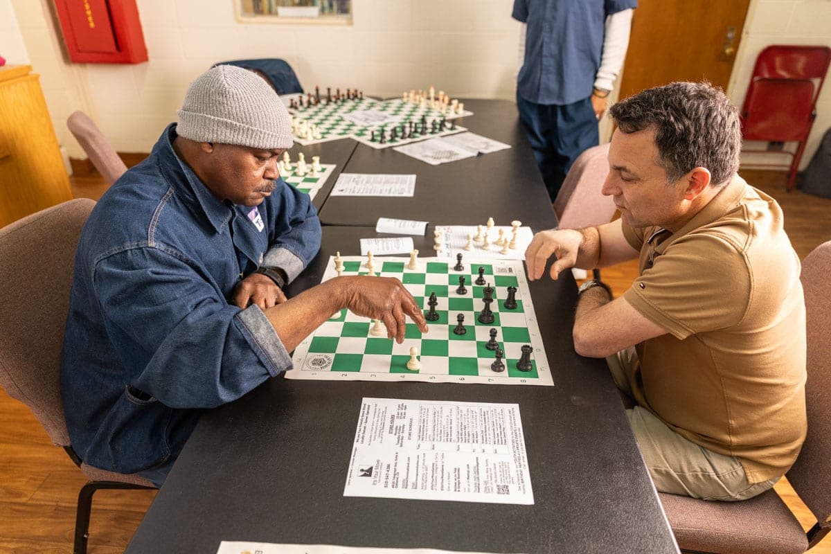 Two people playing chess at San Quentin