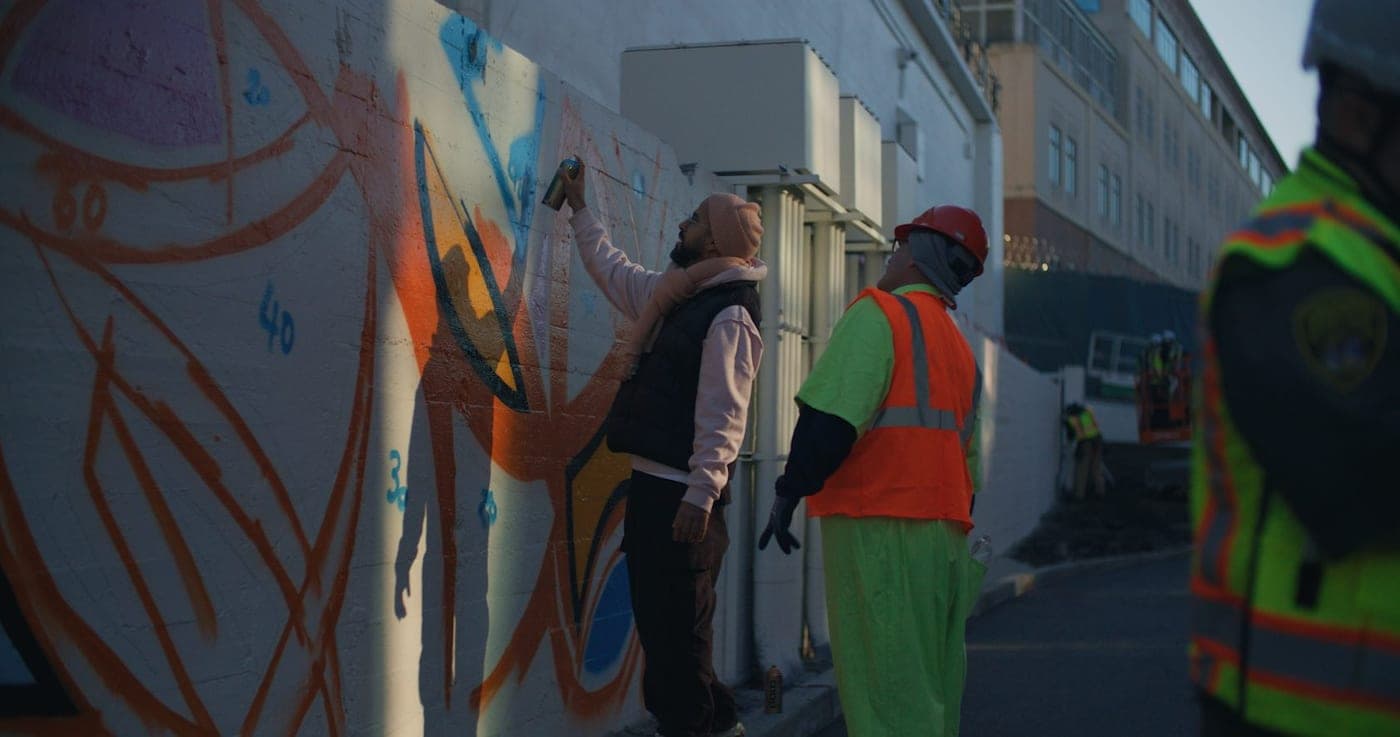 Volunteers working on a mural